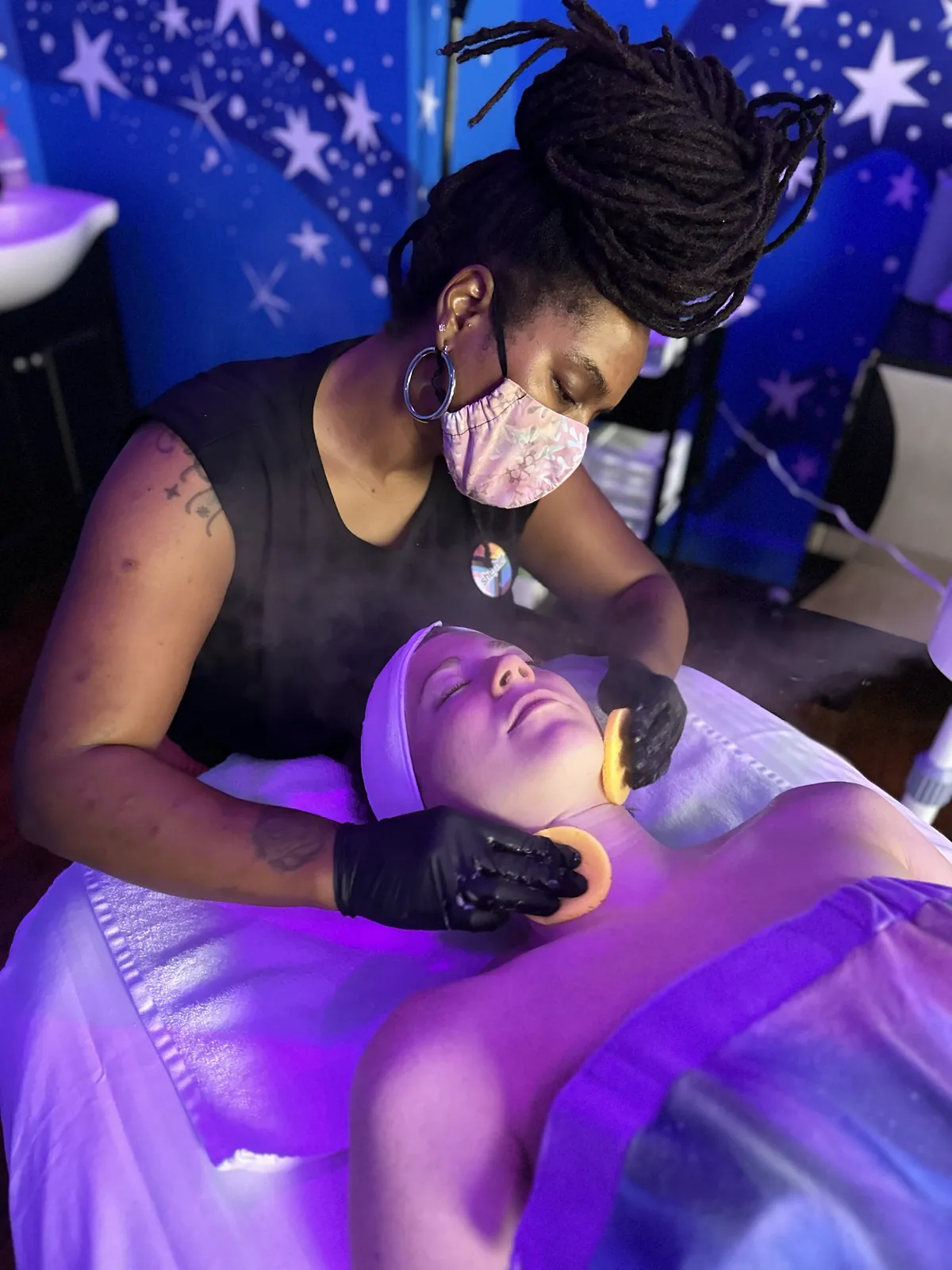 Spa facial beneath the starry mural at Auroraflow